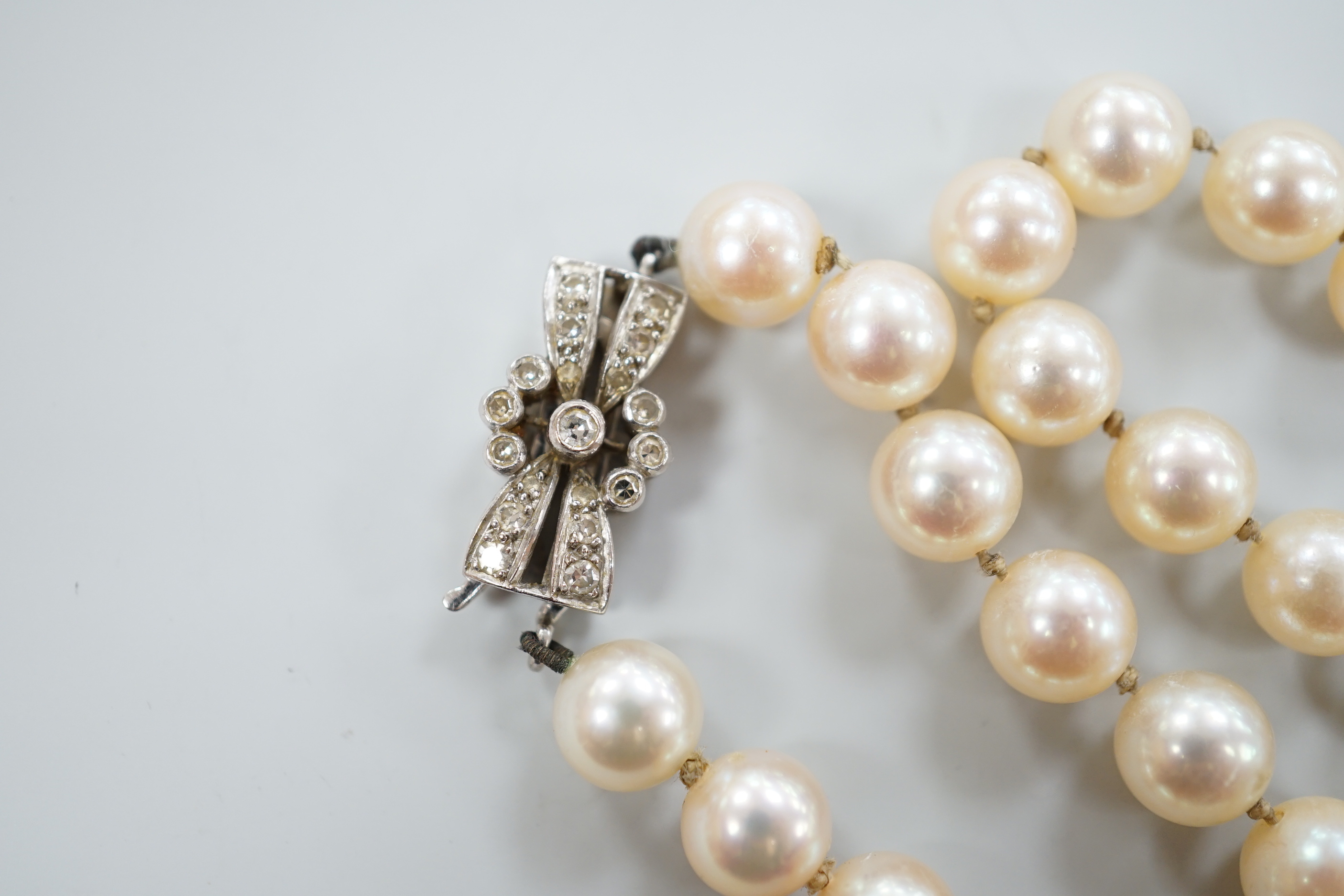 A single strand cultured pearl necklace, with diamond set 18ct white gold clasp, 48cm.